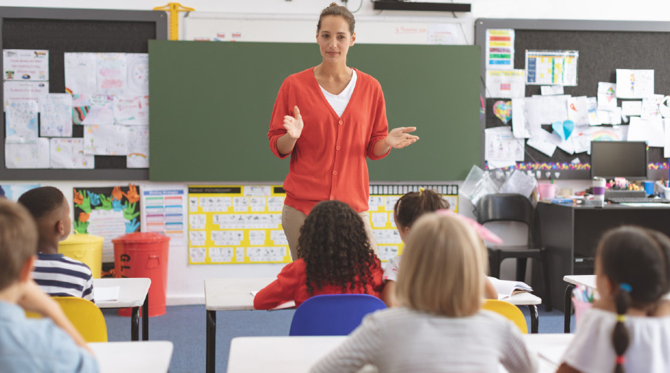 caucasian teacher teaching to elementary students 2026 01 09 11 42 47 utc